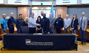 NRCS Employees shake hands with members of Southern Ute Indian Tribe